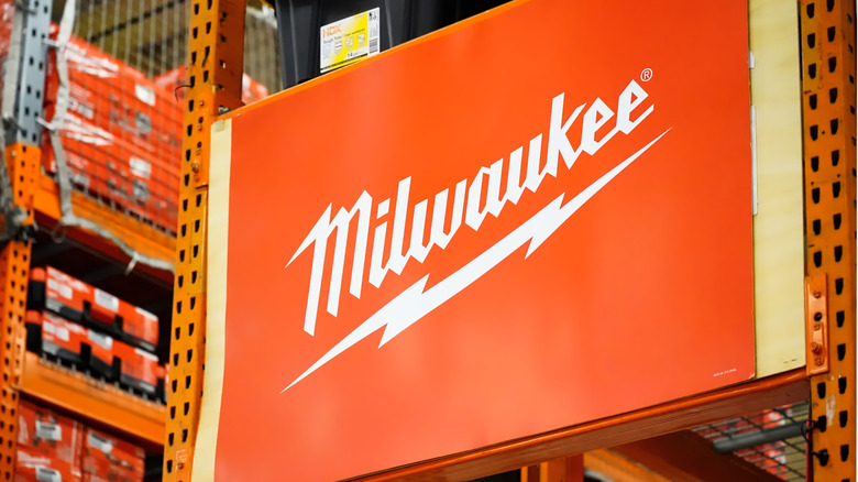 Milwaukee tools logo on a banner in a hardware store