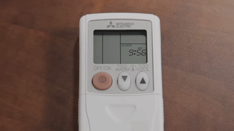 A Mitsubishi mini split remote on desk