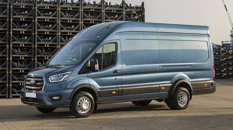 Blue 2025 Ford Transit van seen from the left parked by docks