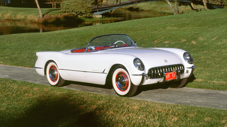 1953 Chevrolet Corvette with red interior parked on a road