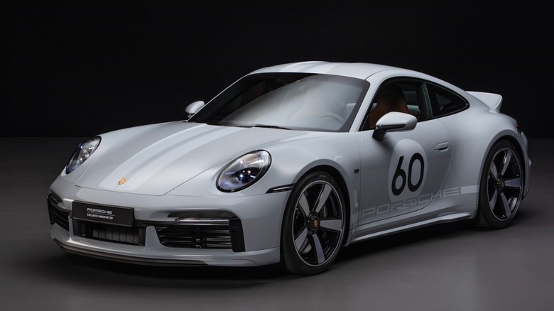 A studio picture of a 2023 Porsche 911 Sport Classic limited edition with the 7 speed manual and a turbocharger.