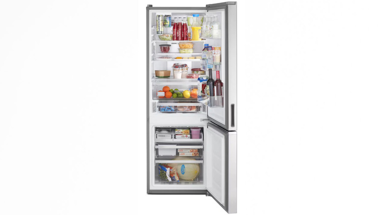 Bottom freezer refrigerator, doors open and fully stocked