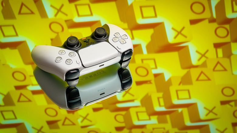 A DualSense controller on a bed of PS+ logos