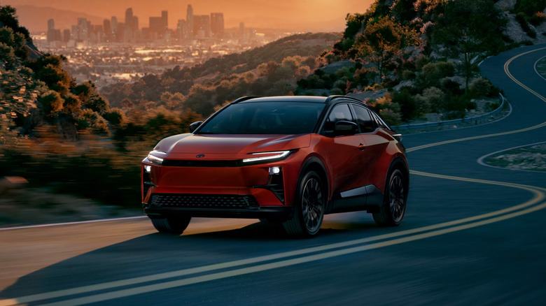 A Toyota C-HR on a winding country road