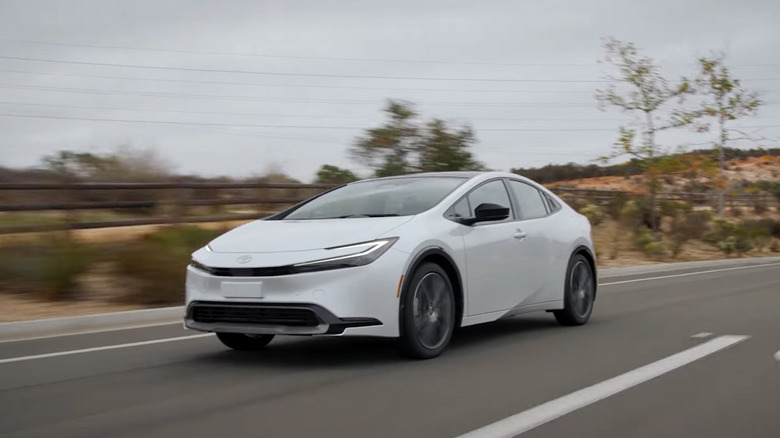 A white Toyota Prius on a highway