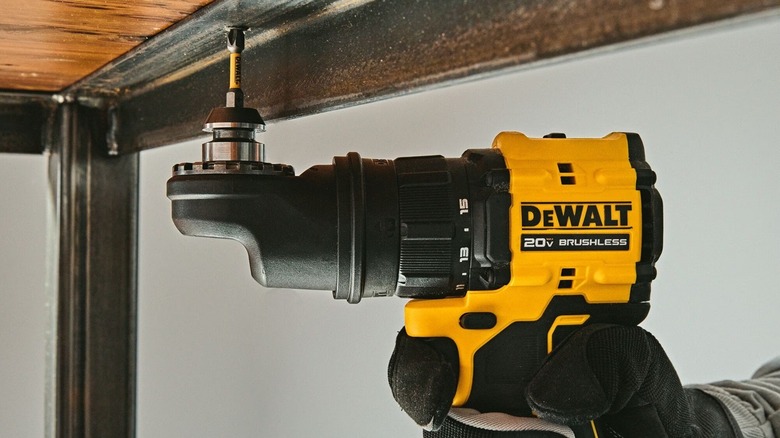 Person using DeWalt multi-head drill
