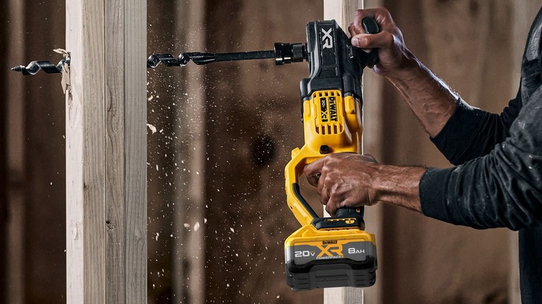 Person using DeWalt stud and joist drill