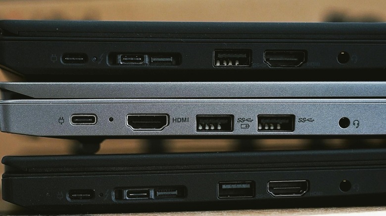 Closeup showing ports of three devices, including USB ports