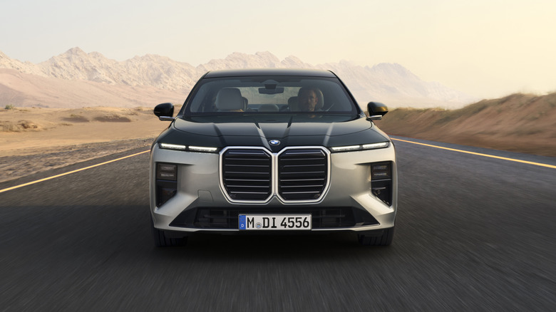 Front view BMW 760 driving on desert road