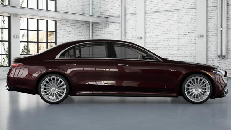Maroon Mercedes AMG S 63 in white-painted showroom