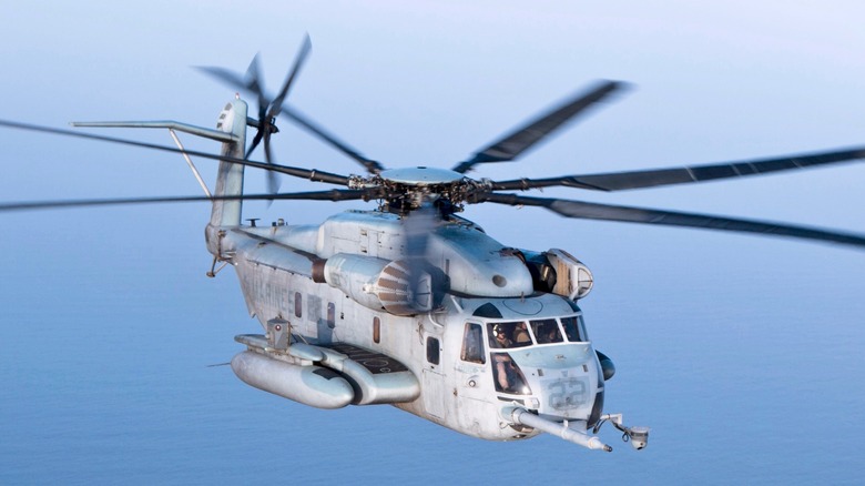 A CH-53E Super Stallion flying over the ocean