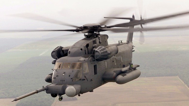 An MH-53E Sea Dragon flying low over farmland