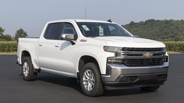 White Chevrolet Silverado 1500 on asphalt concrete