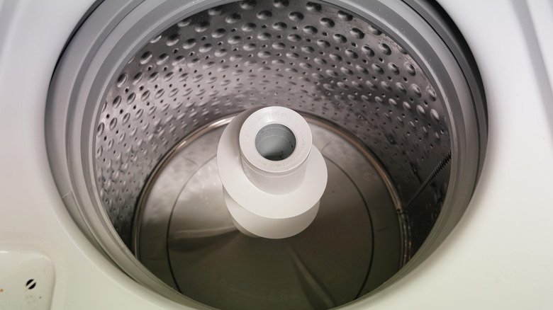 A top-down view of a top-load agitator washing machine.