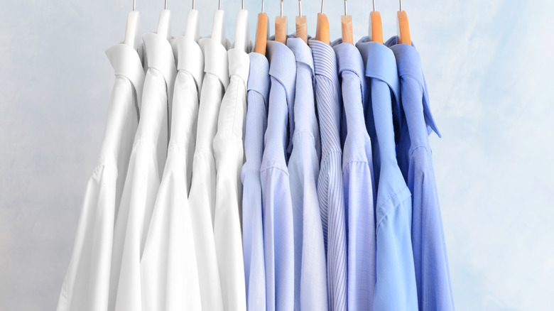 shirts lined up on hangers