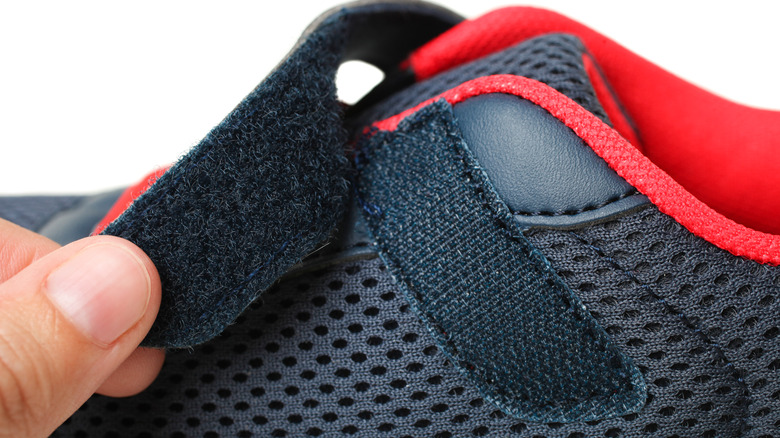 Running shoe with Velcro strap