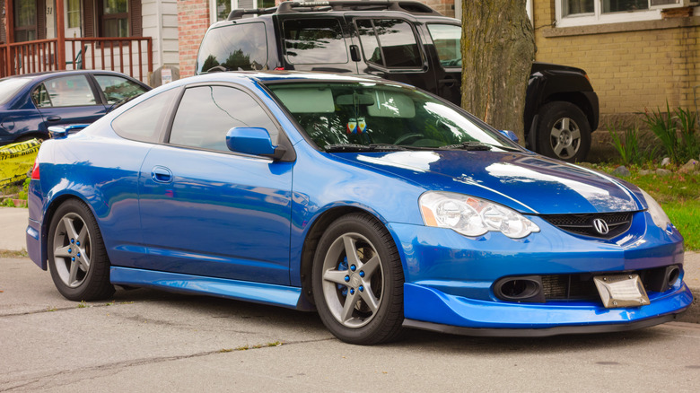 A Blue Acura RSX Parked On The Street