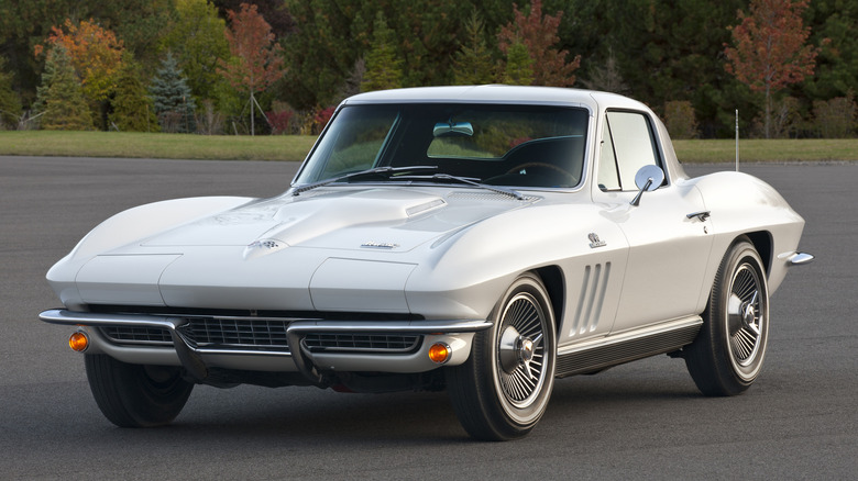 1967 c2 corvette parked pavement