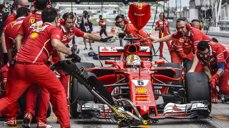 Pit crew working on car