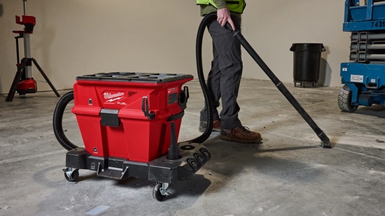 Person using Milwaukee Nexus Vacuum on work site