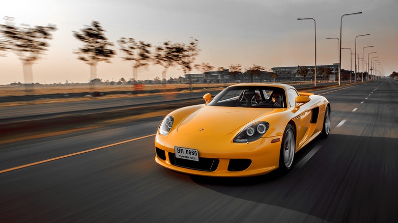 A yellow Porsche Carrera GT