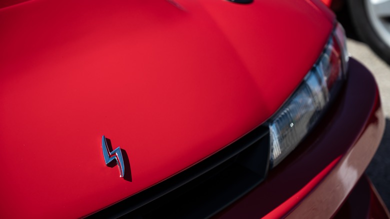 Close up of a Nissan S14 hood and emblem