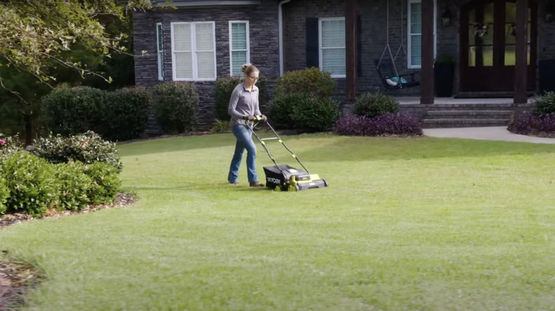 Woman using Ryobi's Dethatcher/Aerator