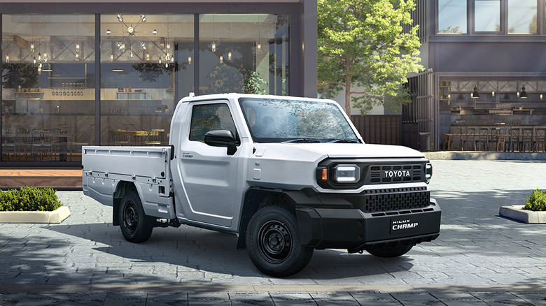 Toyota Hilux Champ parked outside in front of stores