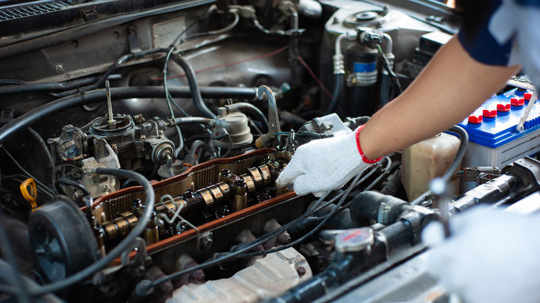 mechanic working with engine