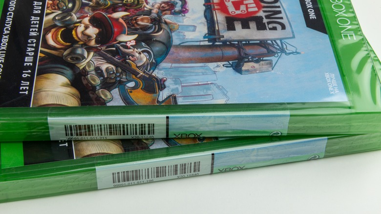 Sealed Xbox game cases stacked