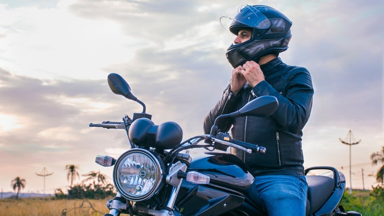 motorcyclist in jacket and helmet