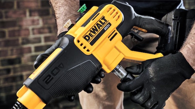 Person holding DeWalt Pressure Washer