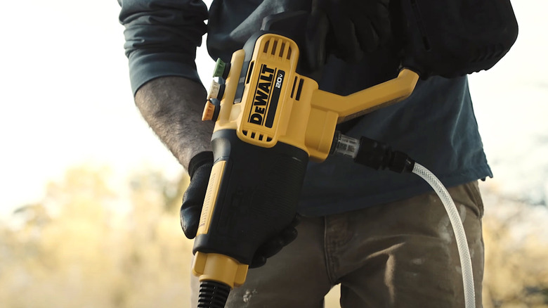 Person holding DeWalt Pressure Washer