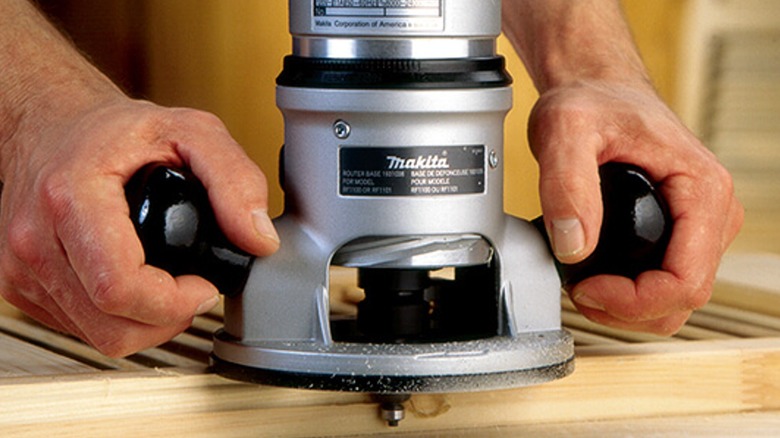 Using a Makita router to form wooden shutter edge