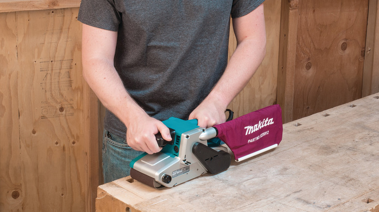 Makita belt sander in action