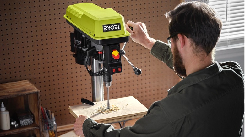 person using Ryobi 10-inch drill press 