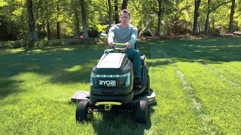 man using Ryobi lawn mower