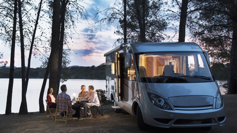 An RV parked in front of a coastline
