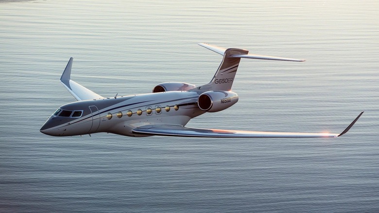 Gulfstream G650ER jet over water