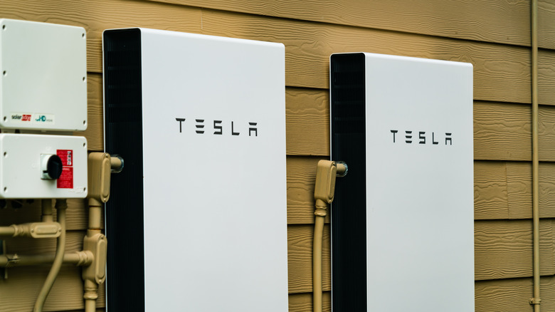 two Tesla Powerwalls on side of house