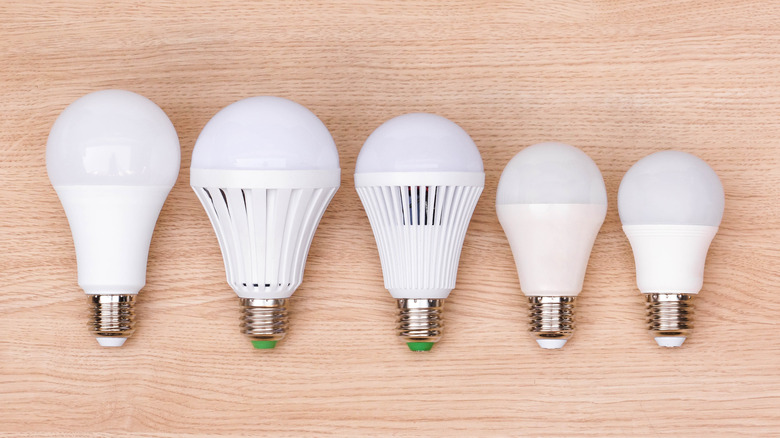 Various LED bulbs arranged on a wooden table