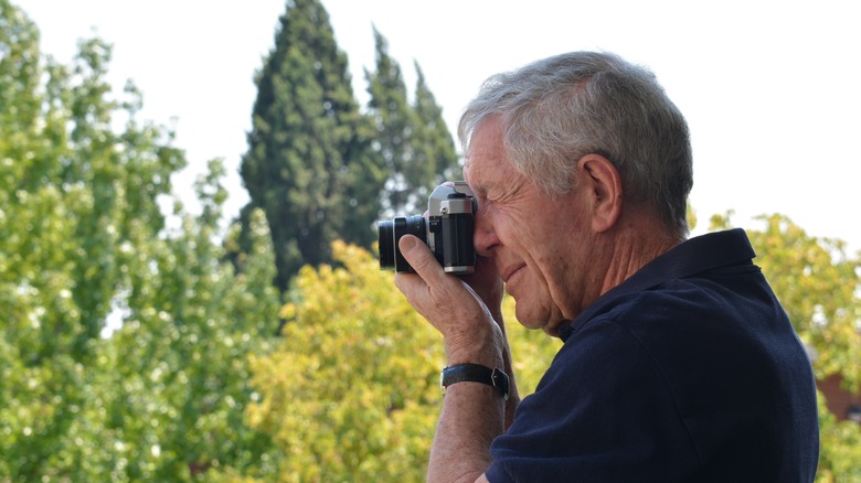 Man using 35mm camera