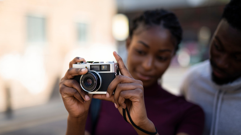 Couple using 35mm camera