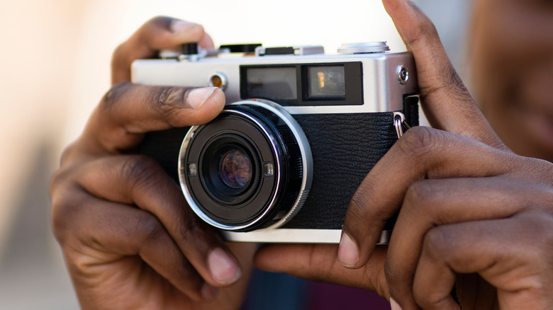 Couple using 35mm camera