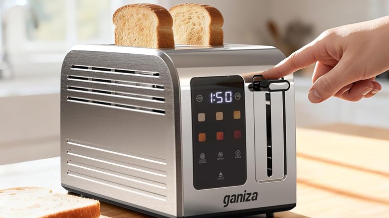 Person using Ganiza Smart Toaster
