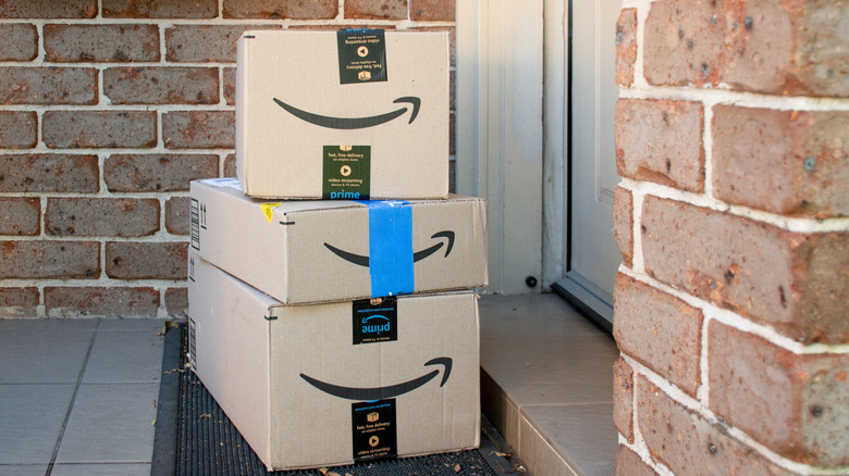 Amazon boxes sitting on a customer's door step