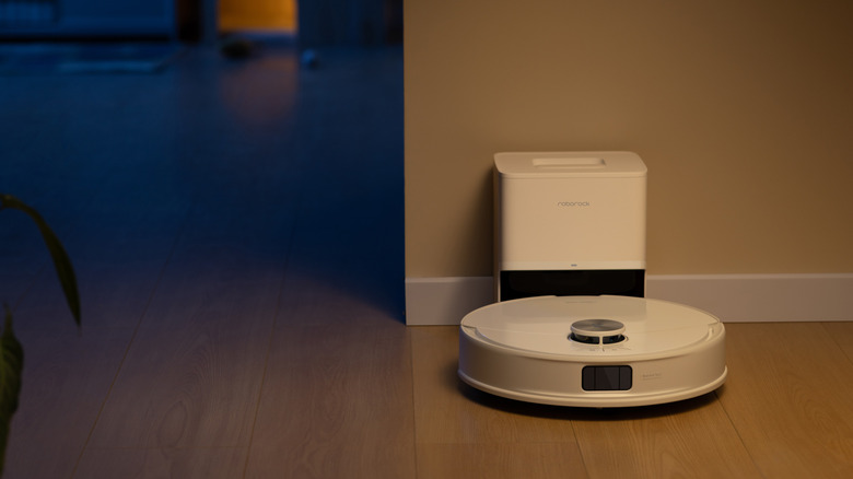 Roborock vacuum docked at night