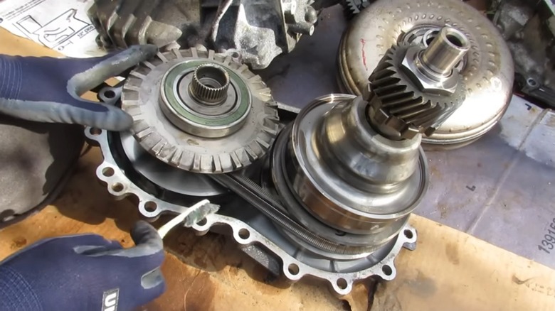 A Nissan CVT Transmission Partly Disassembled To Reveal The Pulleys And Belt