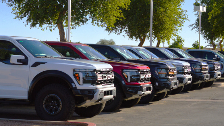 A line of Ford Ranger pickup trucks parked on Ford dealership lot.
