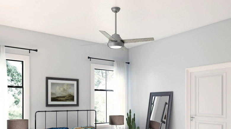 A grey hunter fan in a bedroom